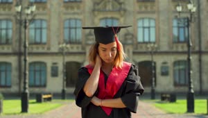 Stock Video Graduate In Cap And Gown Thinks About Future Live Wallpaper For PC