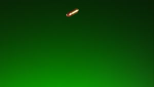 Stock Video Golden Falling Bullets With Green Background Live Wallpaper For PC