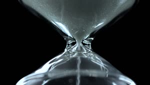 Stock Video Glass Hourglass Close Up On A Black Background Live Wallpaper For PC