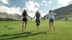 Stock Video Girls Holding Hands And Running Through Open Mountain Landscape Live Wallpaper For PC