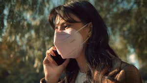 Stock Video Girl With Face Mask Talking On The Cellphone Live Wallpaper For PC