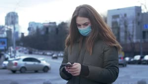 Stock Video Girl Texting With Face Mask On The Street Live Wallpaper For PC