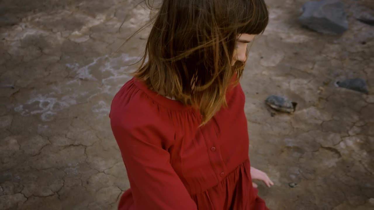 Download Stock Video Girl Stretching With Her Body Sitting In A Desert Live Wallpaper For PC