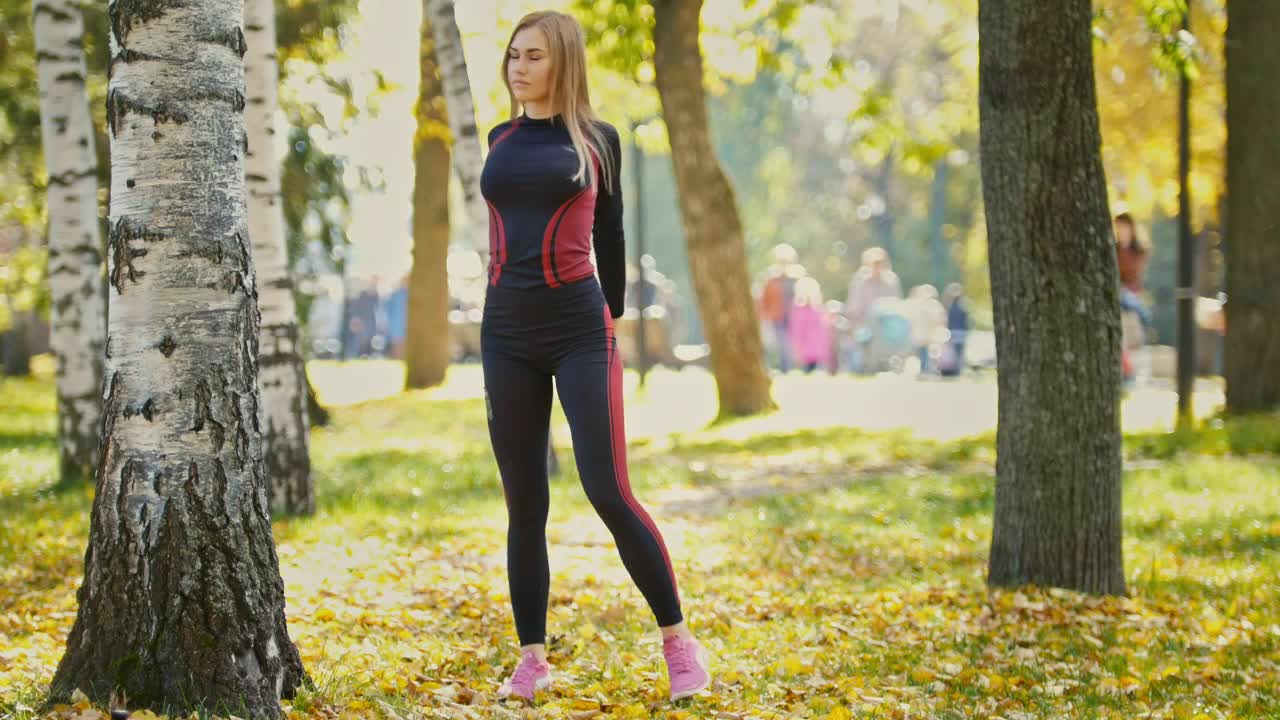 Download Stock Video Girl Stretching And Warming Up In A Sunny Park Live Wallpaper For PC