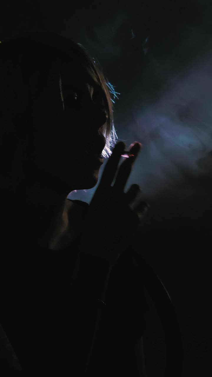 Download Stock Video Girl Smoking In The Shadows With A Backlight Live Wallpaper For PC