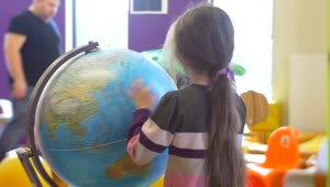 Stock Video Girl Rotating An Earth Globe At School Live Wallpaper For PC
