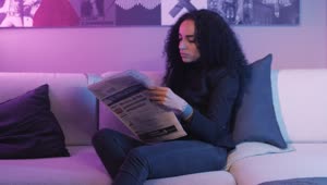 Stock Video Girl Reading The Pages Of A Newspaper Live Wallpaper For PC