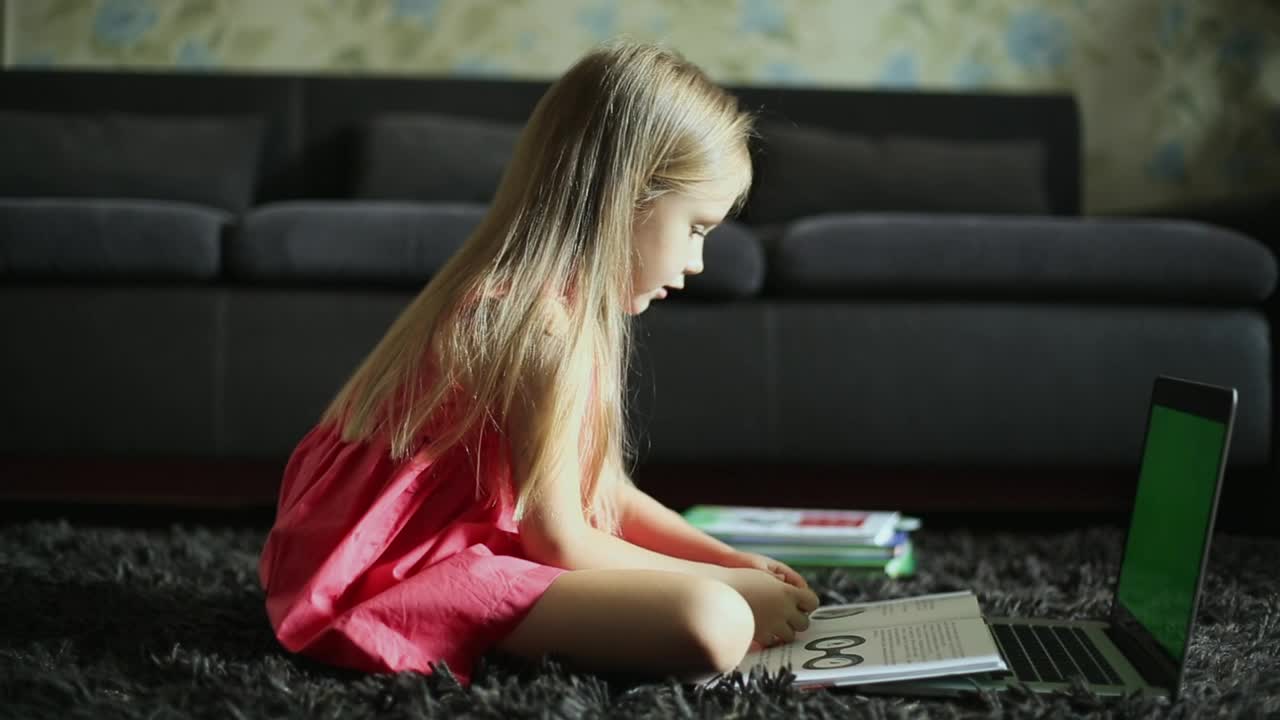 Download Stock Video Girl Reading In Front Of The Laptop At Home Live Wallpaper For PC