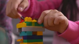 Stock Video Girl Putting Together A Figure With Legos Live Wallpaper For PC