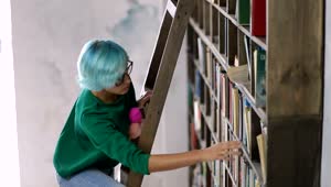 Stock Video Girl On A Ladder Looking In A Huge Bookcase Live Wallpaper For PC