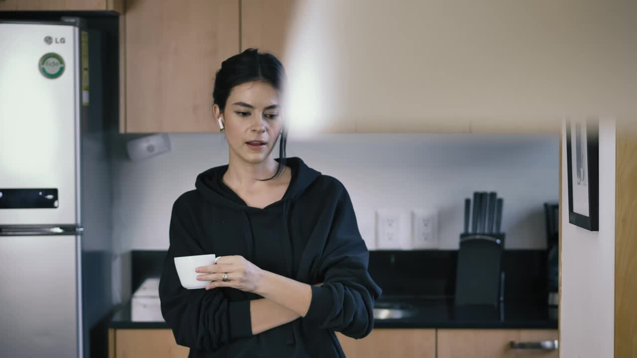 Download Stock Video Girl On A Call While Drinking A Cup Of Coffee Live Wallpaper For PC