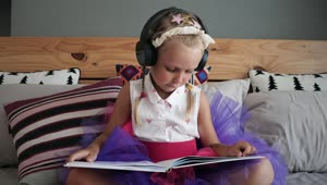 Stock Video Girl Listening To Music And Reading On The Bed Live Wallpaper For PC