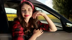 Stock Video Girl Leaning Out Of The Window Of A Stopped Car Live Wallpaper For PC