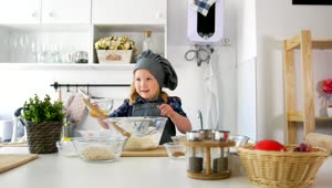 Stock Video Girl In The Kitchen Preparing A Mixture In A Bowl Live Wallpaper For PC