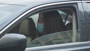 Stock Video Girl In A Car Coughing With Face Mask Live Wallpaper For PC
