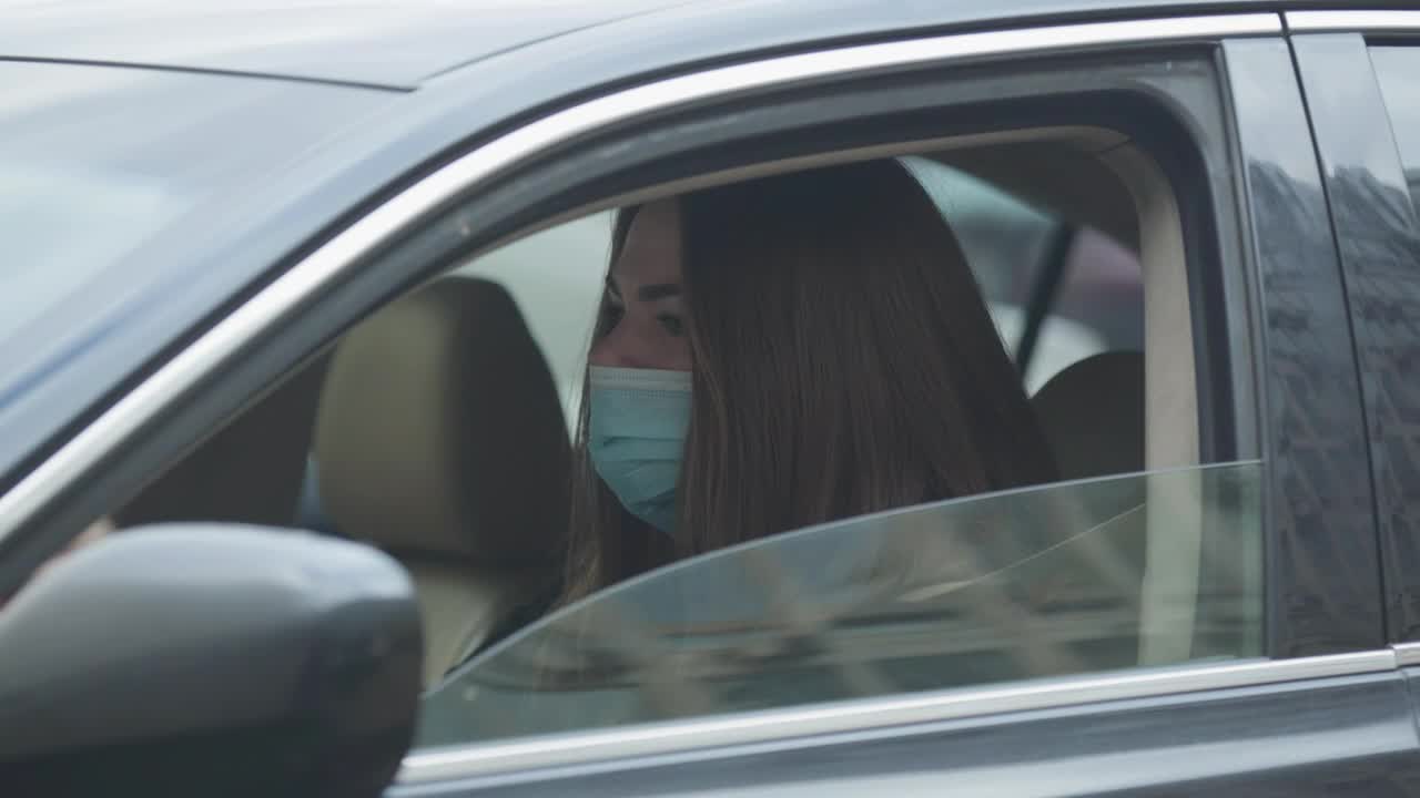 Download Stock Video Girl In A Car Coughing With Face Mask Live Wallpaper For PC