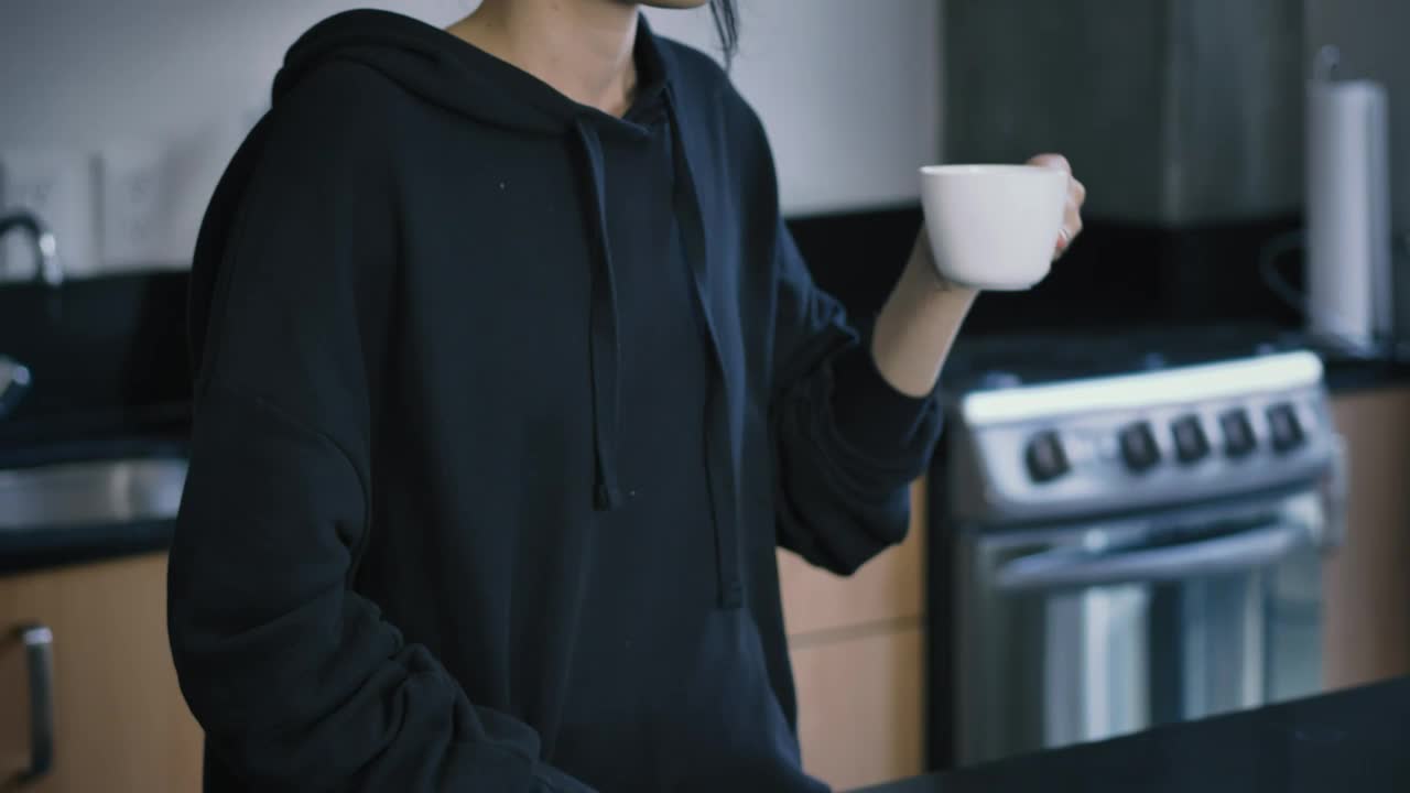 Download Stock Video Girl Drinking A Cup Of Coffee While On A Call Live Wallpaper For PC