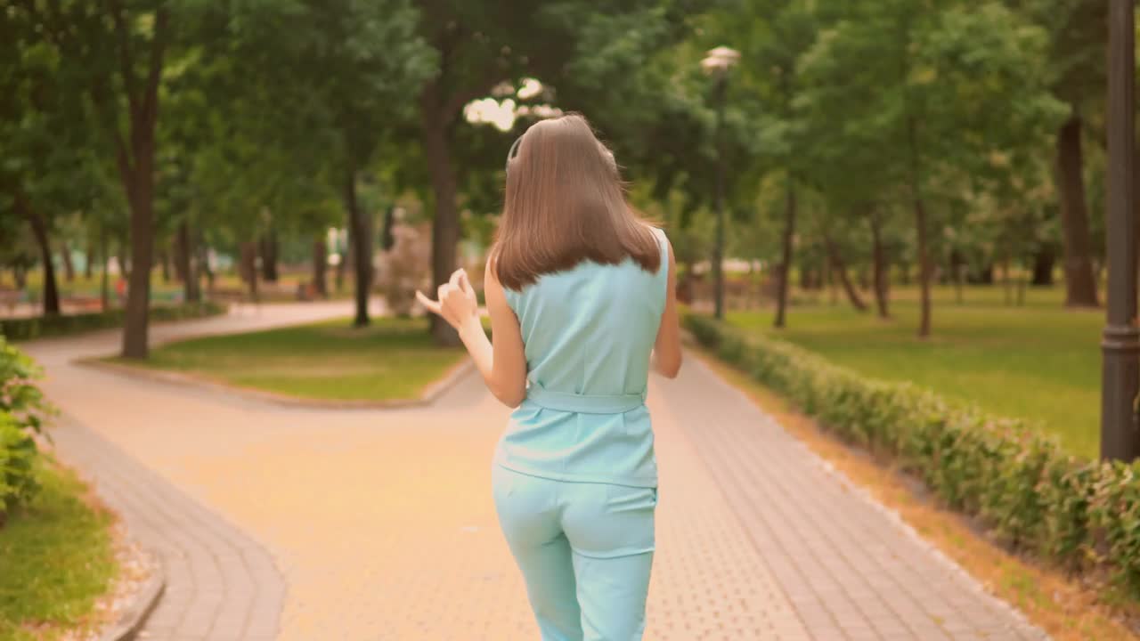 Download Stock Video Girl Dancing With Her Headphones While Taking A Walk Live Wallpaper For PC