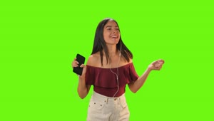 Stock Video Girl Dancing With Her Earphones On A Green Background Live Wallpaper For PC