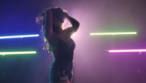 Stock Video Girl Dancing On A Dark Floor Under Colored Lights Live Wallpaper For PC