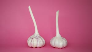 Stock Video Garlic Spinning On A Pink Background Live Wallpaper For PC