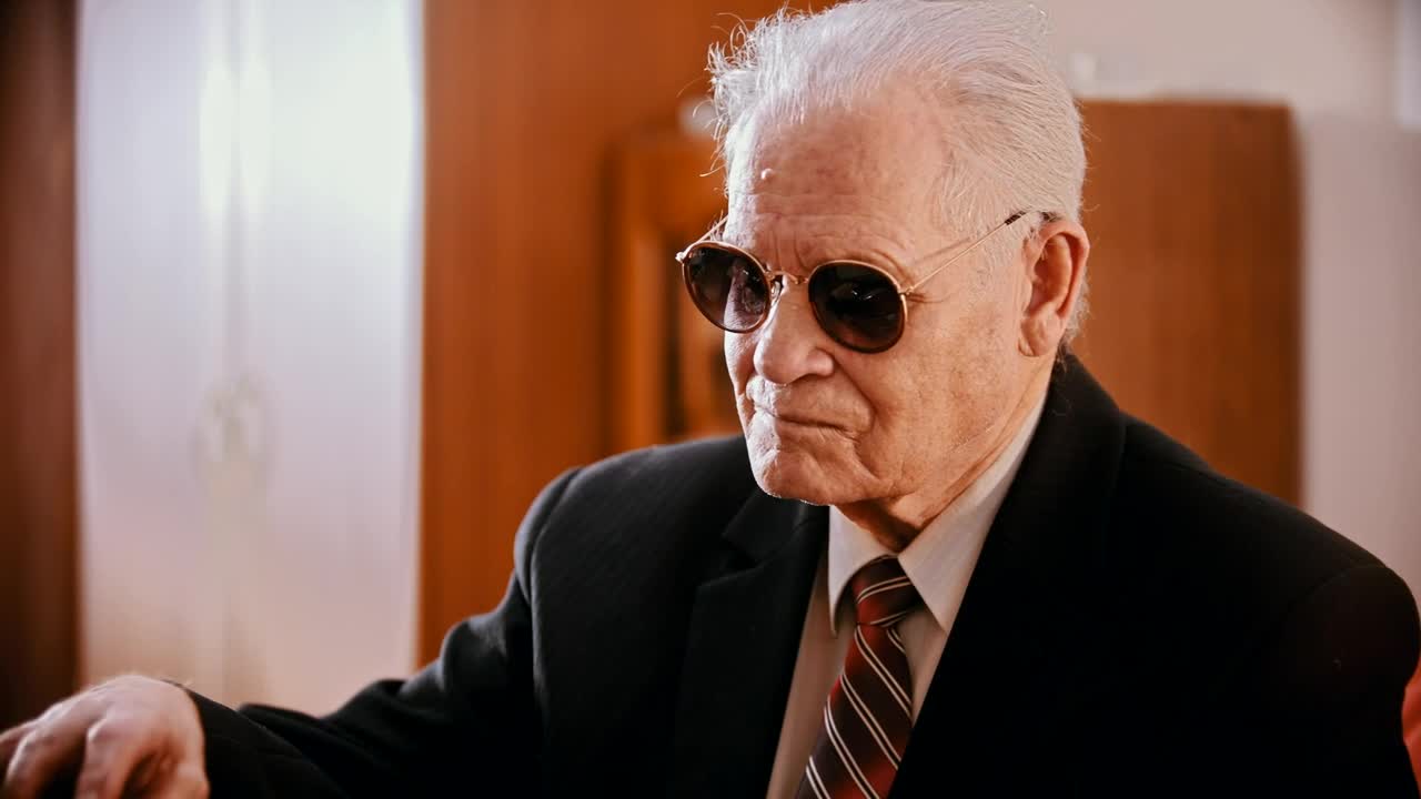 Download Stock Video Gangster With Sunglasses Preparing A Gun Live Wallpaper For PC