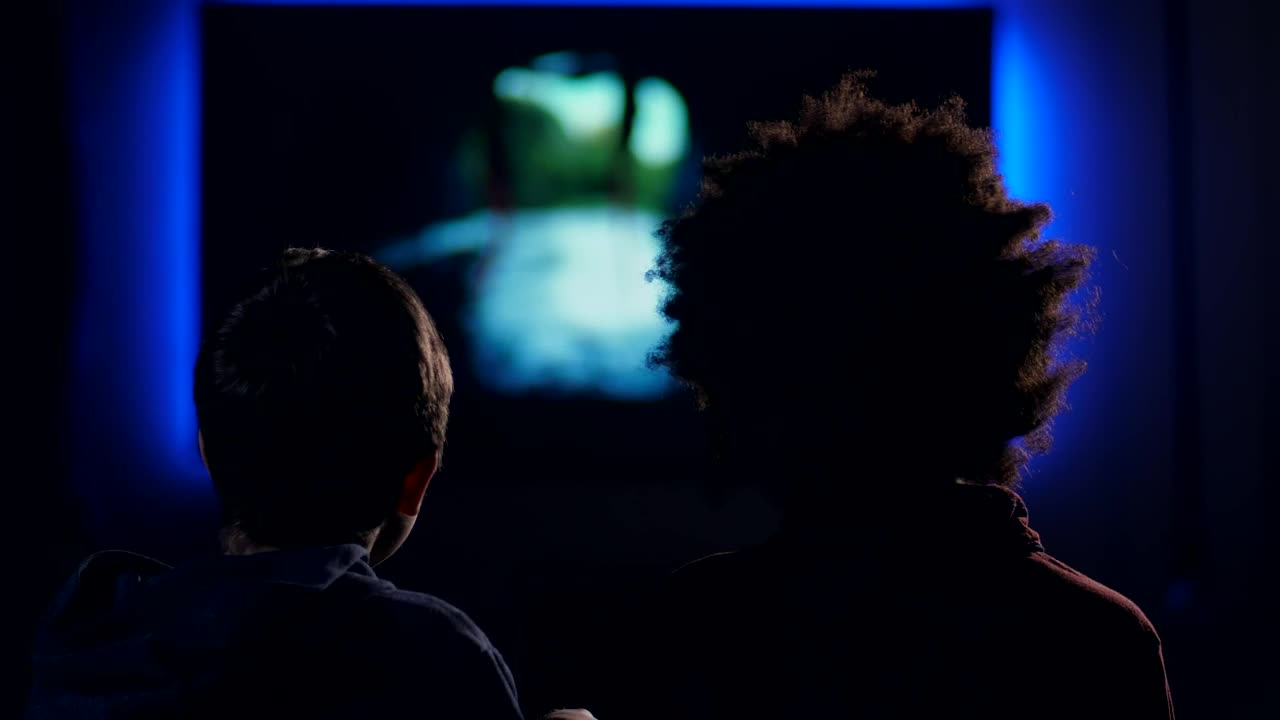 Download Stock Video Friends Watching A Film In A Dark Room Live Wallpaper For PC