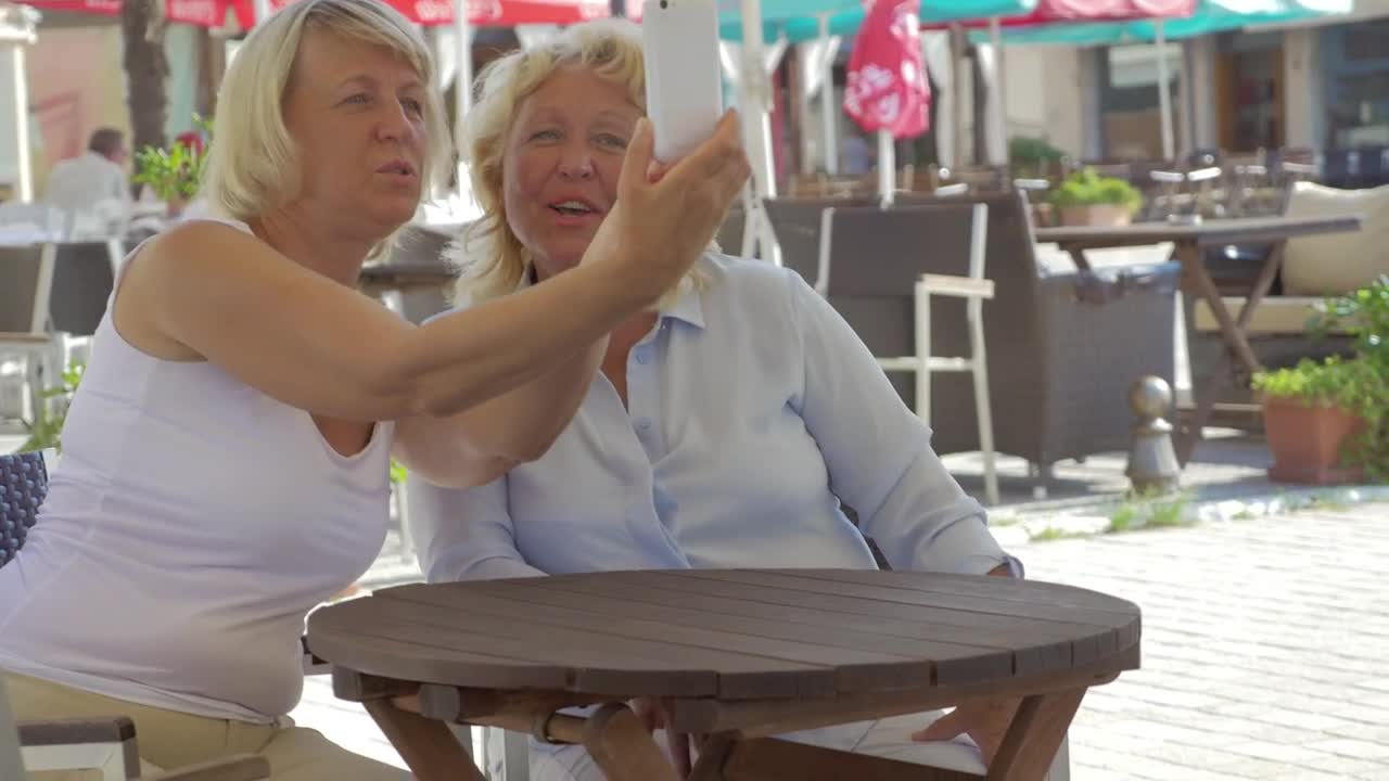 Download Stock Video Friends Taking A Photo During An Afternoon Out Live Wallpaper For PC