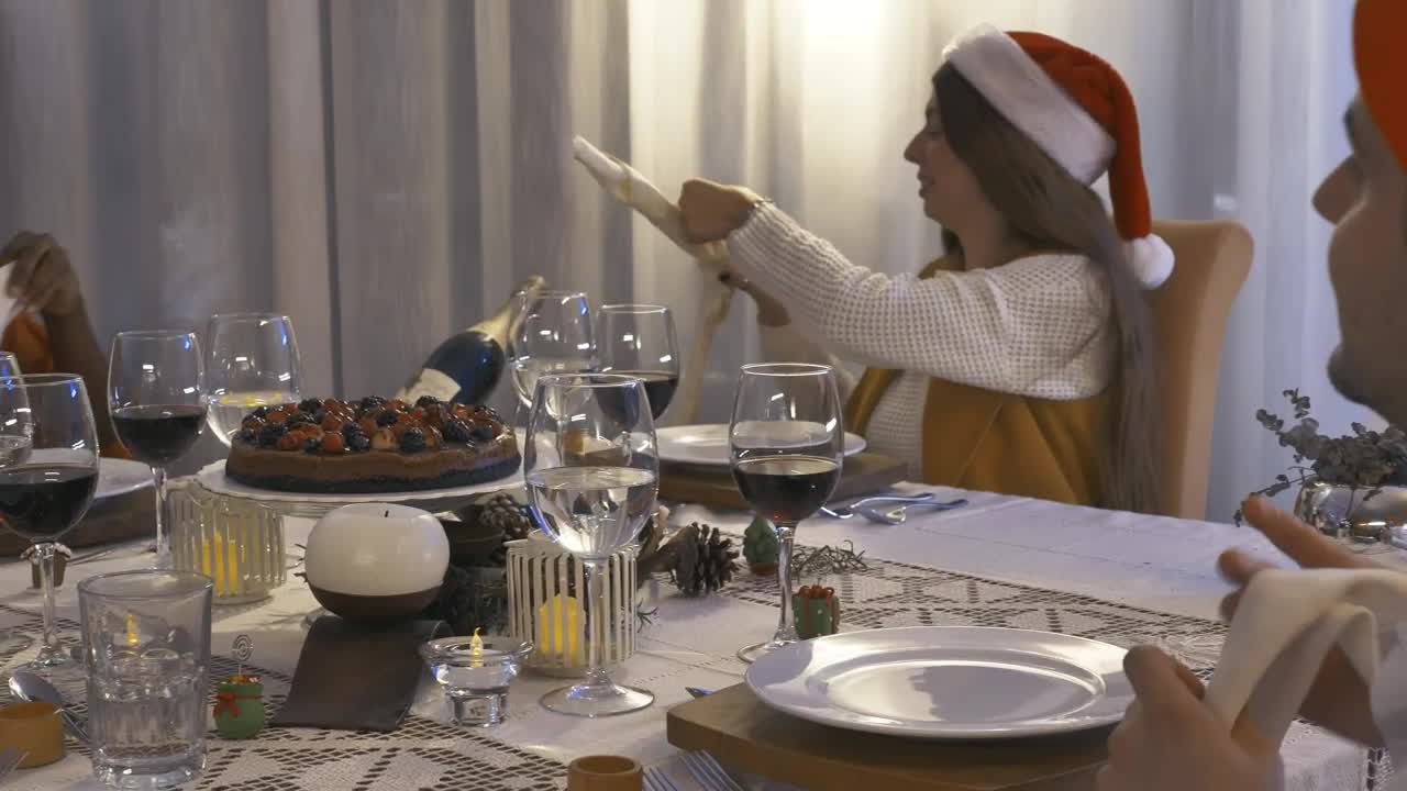 Download Stock Video Friends Sitting At A Table Setting For Christmas Dinner Live Wallpaper For PC