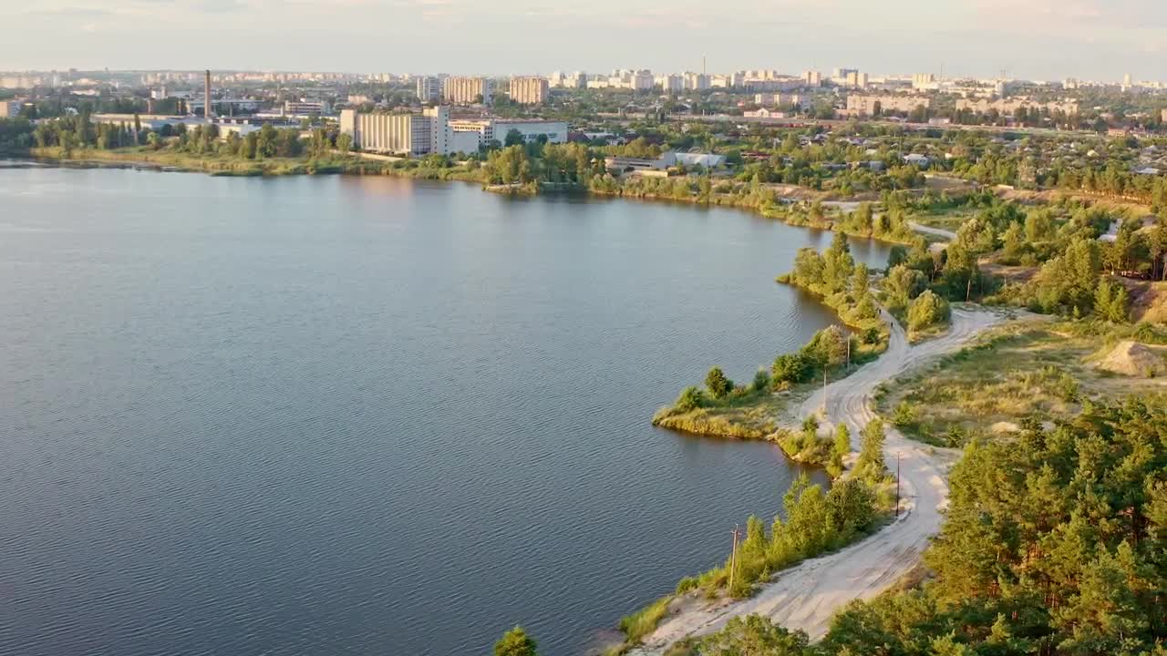 Download Stock Video Lake Near A City Aerial View Animated Wallpaper