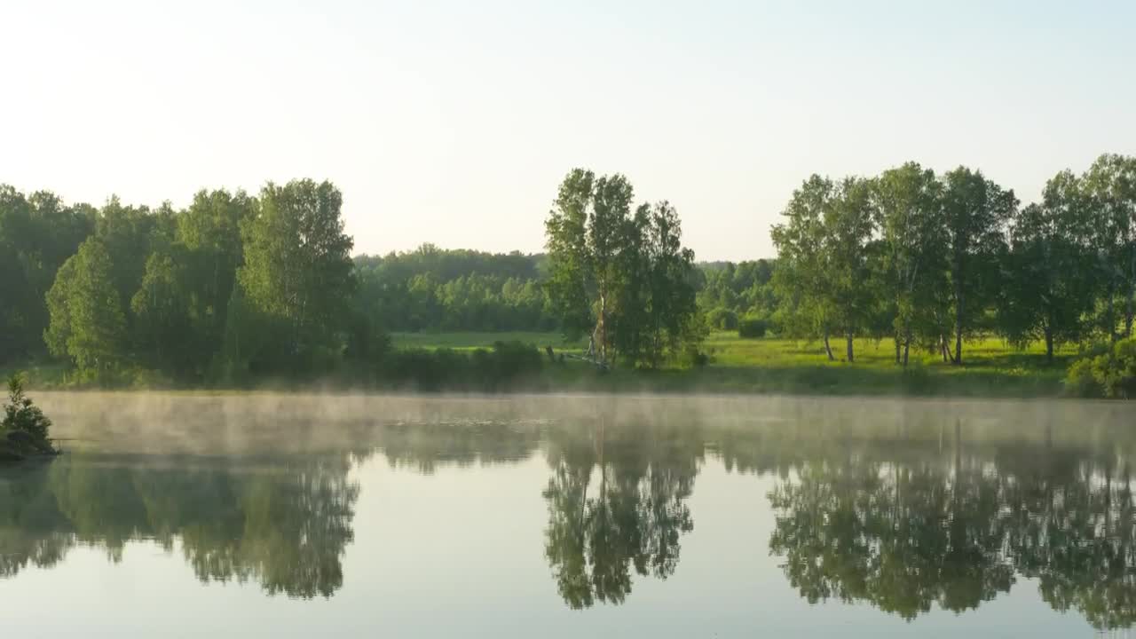 Download Stock Video Lake In The Morrning With Mist Animated Wallpaper