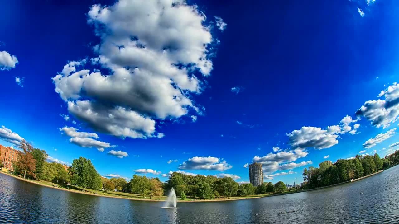 Download Stock Video Lake Fountain On A Hot Day Animated Wallpaper
