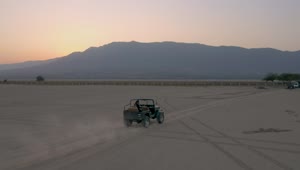 Stock Video Jeep Crossing A Plain Of Land In An Aerial Shot Animated Wallpaper