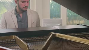 Stock Video Inspired Pianist Playing In An Elegant House Animated Wallpaper