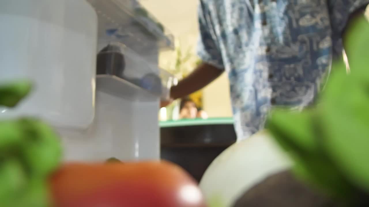 Download Stock Video Inside View Of A Fridge When A Man Takes A Animated Wallpaper