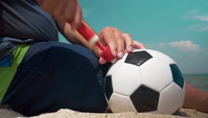 Stock Video Inflating A Ball At The Beach Animated Wallpaper