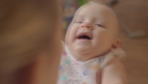 Stock Video Infant Laughing With Her Mother Animated Wallpaper