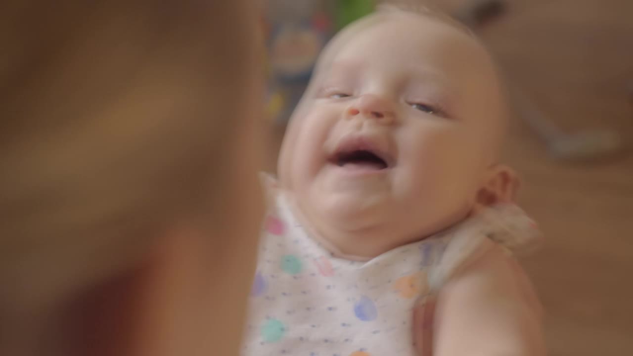 Download Stock Video Infant Laughing With Her Mother Animated Wallpaper