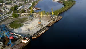 Stock Video Industrial Cranes And Cargo Ships By The River Animated Wallpaper