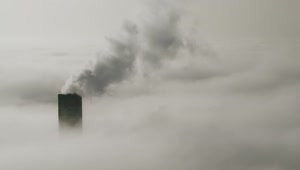 Stock Video Industrial Chimneys Above The Clouds And Environmental Pollution Animated Wallpaper