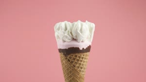 Stock Video Ice Cream Cone With Syrup On A Pink Background Animated Wallpaper