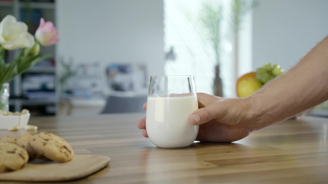 Download Stock Video I Am Taking A Glass Of Milk From The Table Animated Wallpaper