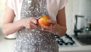 Stock Video Housewife Peeling An Apple With A Knife Animated Wallpaper