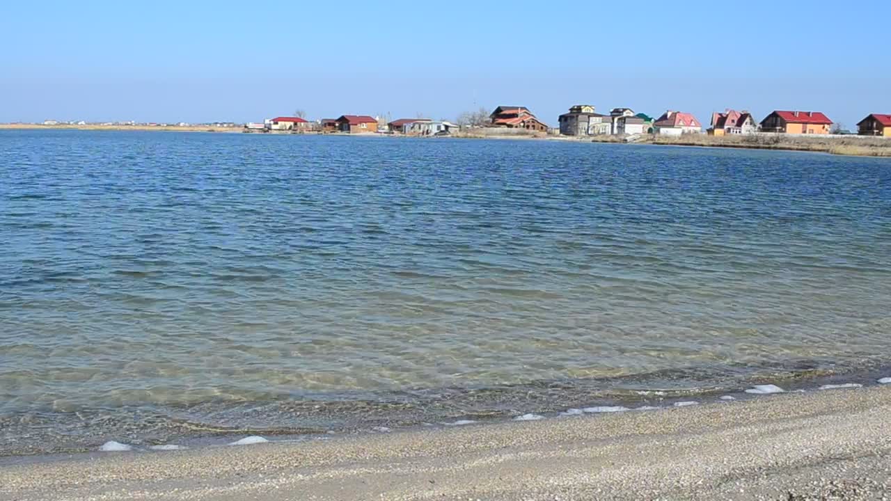 Download Stock Video Houses Next To The Sea Animated Wallpaper