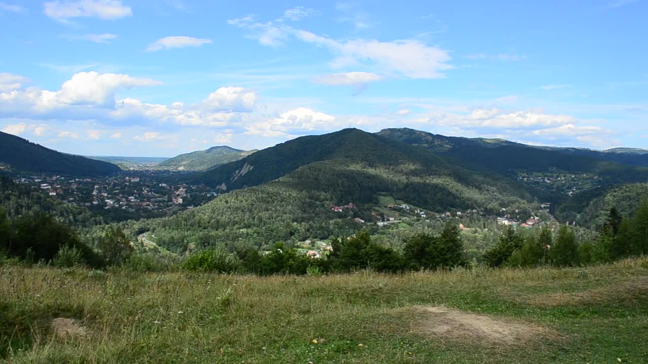 Download Stock Video Houses Between Mountains Animated Wallpaper