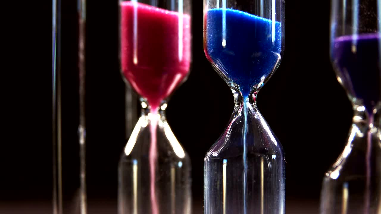 Download Stock Video Hourglasses On Black Background Close Up Animated Wallpaper