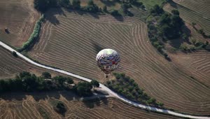 Stock Video Hot Air Balloon Flying Over The Fields Animated Wallpaper