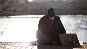 Stock Video Homeless With A Cardboard Sign Looking For A Job Animated Wallpaper