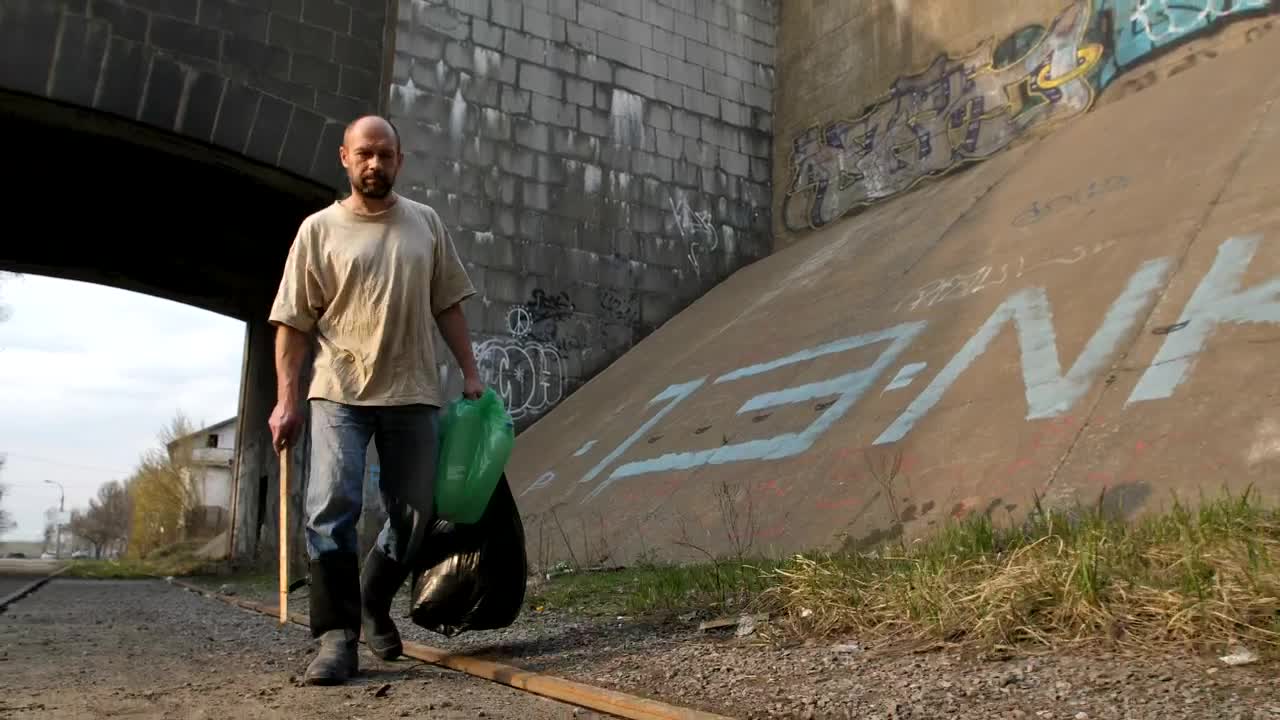 Download Stock Video Homeless Man Walking With Bags Animated Wallpaper
