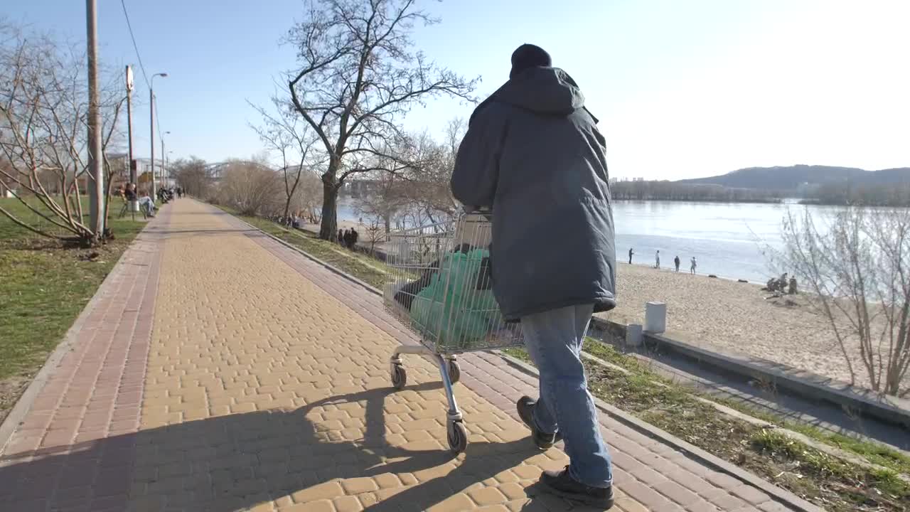 Download Stock Video Homeless Man Walking By The Lake Animated Wallpaper
